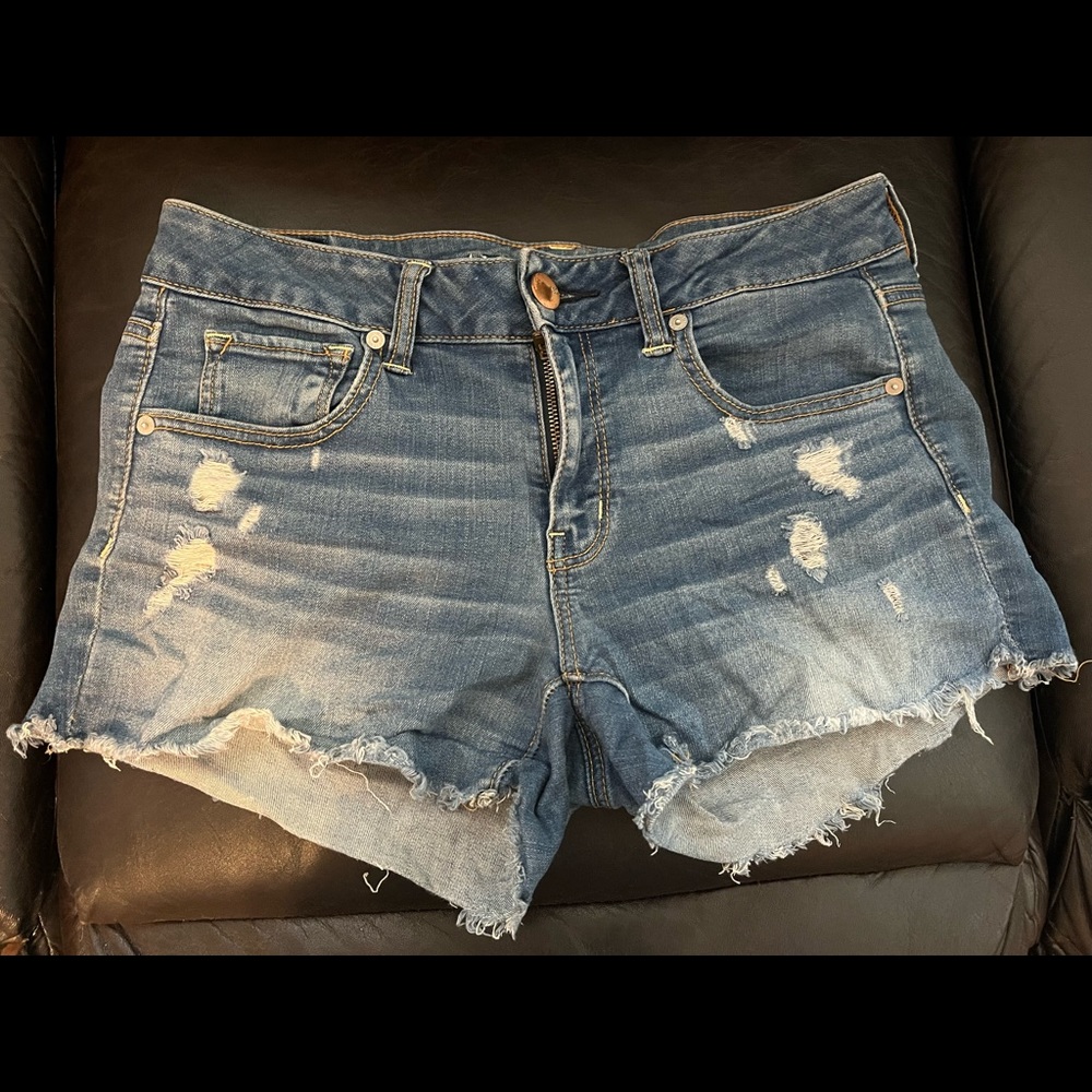 Medium wash, ripped, American Eagle jean shorts.